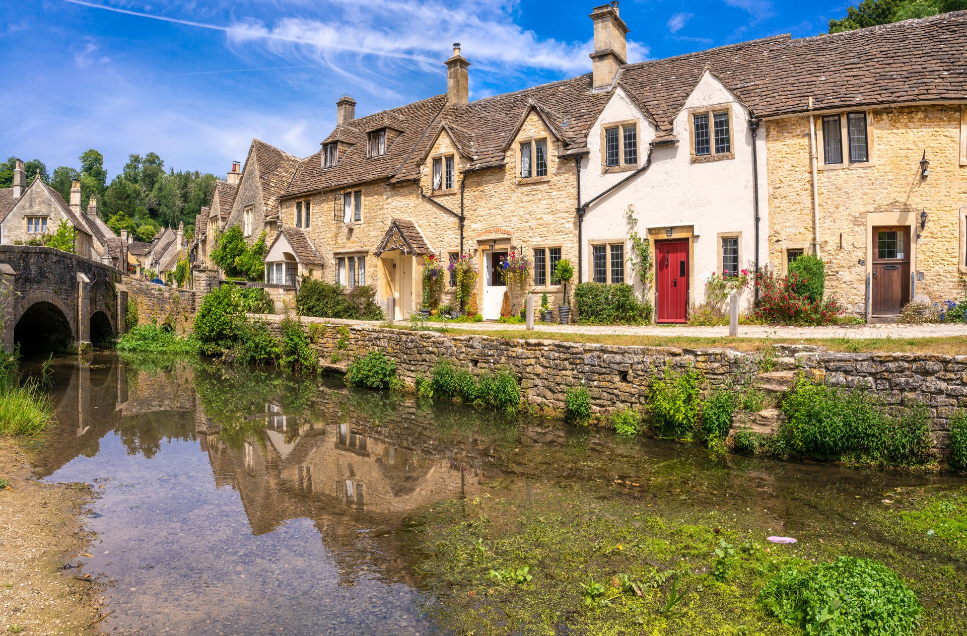 Castle Combe village and By Brook river, Wiltshire in the England Cotswolds UK